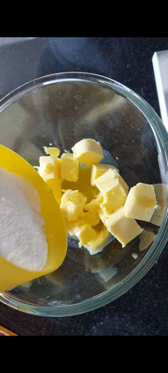 Step 1.2: In a bowl mix butter, sugar and lemon zest till creamy