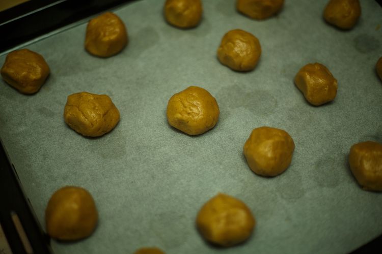 Step 1.2: **Scoop tablespoon-sized portions of dough and roll them into balls