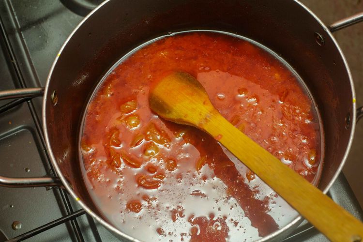 Step 1.1: Stir in the blended tomatoes and Scotch bonnet peppers (if using)