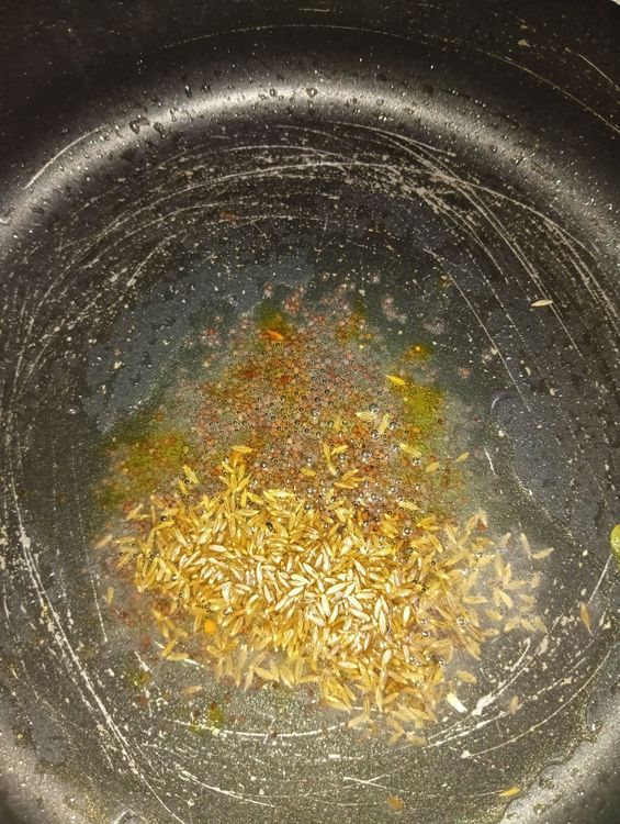 Step 1.1: Heat the kadai on the stove and add vegetable oil