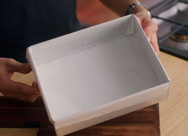Step 2.1: Lightly oil a tray and place a butter paper sheet on it for rolling later