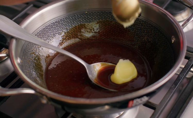 Step 4.1: Switch off the flame and add 1 tbsp ghee, stirring until glossy