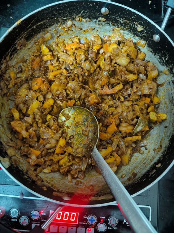 Step 1.1: Add tomato puree and cook until the oil separates