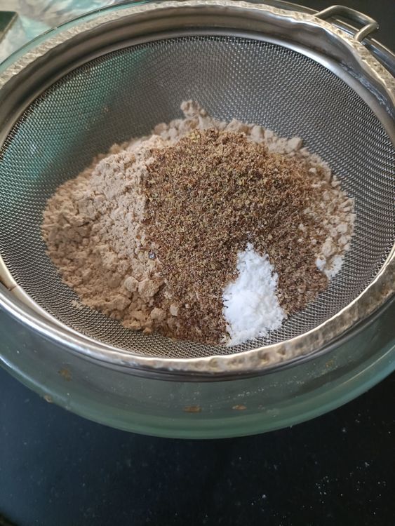Step 1.1: Sieve sorghum flour, almond flour, flaxmeal, baking soda, and jaggery powder