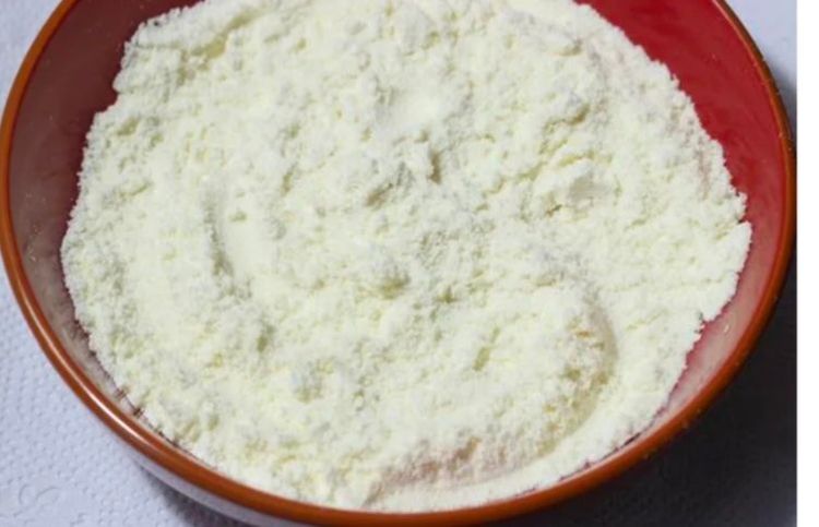 Step 1.2: Add ghee and mix well to make the flour moist