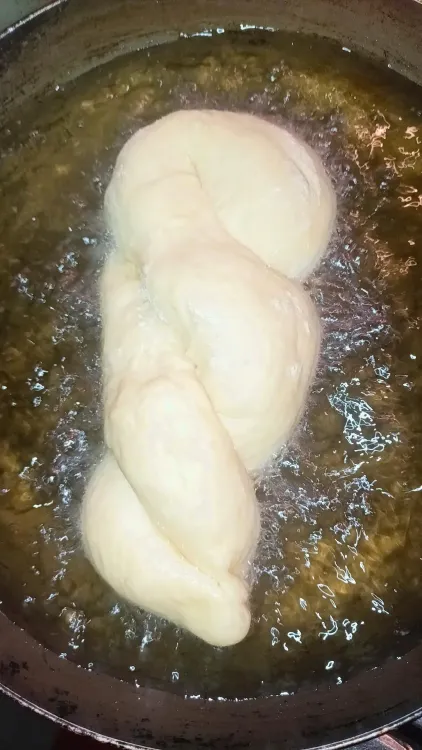 Step 1.1: When the oil is ready, fry twists until golden brown on each side