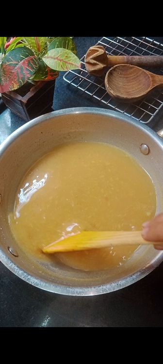 Step 4.1: Once the broth boils lower the flame and add thick coconut milk to enhance the taste of Moong dal Payasam