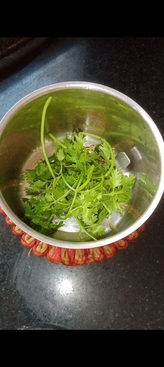 Step 1.3: In a chutney grinder jar , add green chillies, cumin seeds and coriander leaves