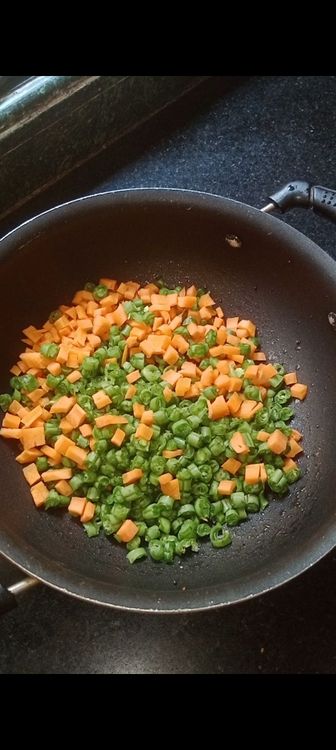 Step 1.2: Once they crackle and turn brownish in colour , add pinch of asafoetida with the chopped veggies
