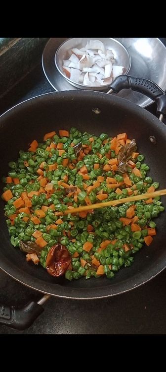 Step 1.3: Once they crackle and turn brownish in colour , add pinch of asafoetida with the chopped veggies