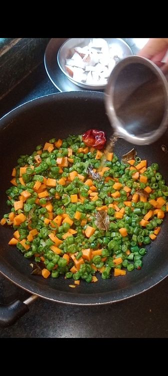 Step 1.4: Once they crackle and turn brownish in colour , add pinch of asafoetida with the chopped veggies