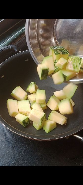 Step 1.1: Chop pumpkin and tomato into medium size cubes and put on a hollow pan