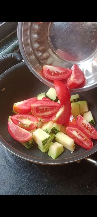 Step 1.2: Chop pumpkin and tomato into medium size cubes and put on a hollow pan