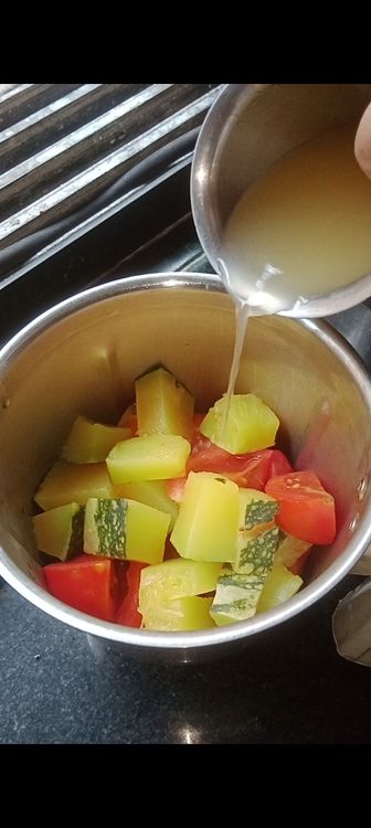 Step 1.1: Add the strained veggies to the mixie jar with 1 cup of broth and grind into fine paste