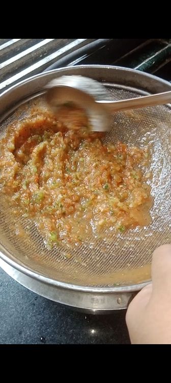 Step 1.3: Add the strained veggies to the mixie jar with 1 cup of broth and grind into fine paste