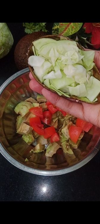 Step 1.2: Add the veggies like tomato, cabbage, onion and coriander leaves You can add other veggies as well of your choice like cucumber, sweet corn, capsicum, etc