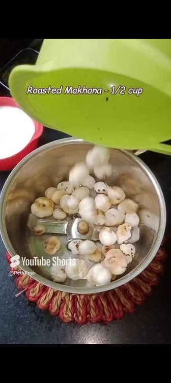 Step 1.1: In a mixie jar, add makhana , curd , cashews, saffron milk, cardamom pods, jaggery cubes and blend smooth