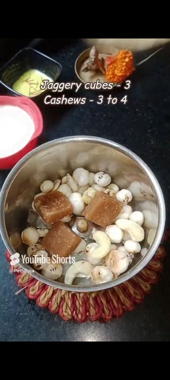Step 1.2: In a mixie jar, add makhana , curd , cashews, saffron milk, cardamom pods, jaggery cubes and blend smooth