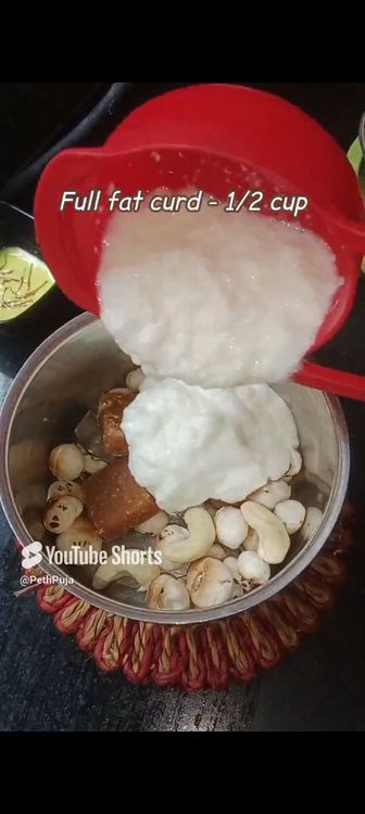 Step 1.3: In a mixie jar, add makhana , curd , cashews, saffron milk, cardamom pods, jaggery cubes and blend smooth