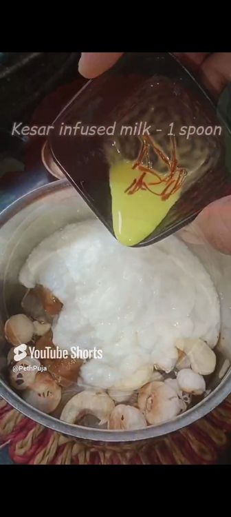 Step 1.4: In a mixie jar, add makhana , curd , cashews, saffron milk, cardamom pods, jaggery cubes and blend smooth