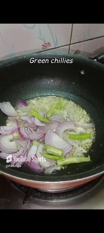 Step 1.1: Next add sliced onion and slit green chillies