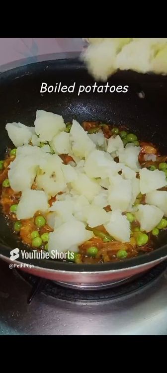 Step 1.1: Once the masalas get properly mixed with the peas, add diced boiled potato, salt to taste and mix well