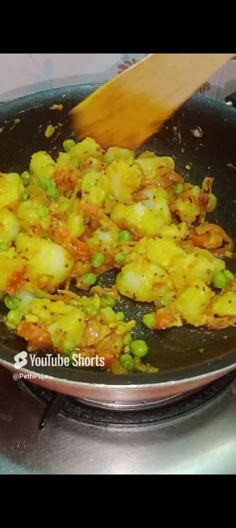 Step 1.2: Once the masalas get properly mixed with the peas, add diced boiled potato, salt to taste and mix well
