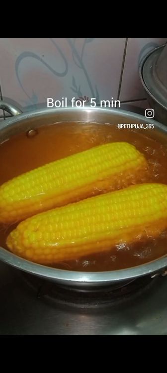 Step 1.2: Boil enough water in a vessel , add the washed corns with turmeric powder and salt to taste