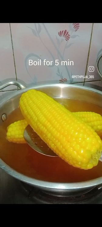 Step 1.3: Boil enough water in a vessel , add the washed corns with turmeric powder and salt to taste