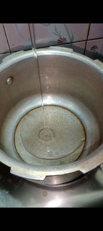 Step 1.1: Heat oil in a pressure cooker and add mustard seeds followed by cumin seeds and asafoetida