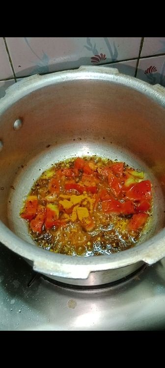 Step 1.1: Add masalas like turmeric powder, kashmiri red chilli powder, coriander powder and salt to taste