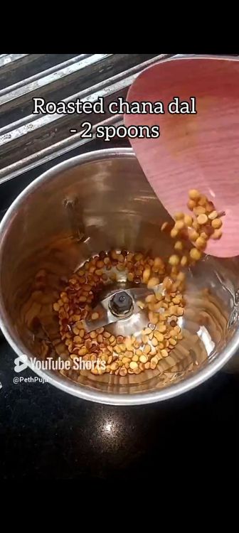 Step 1.1: In a mixie jar, put roasted chana dal, green cardamom pods, grated coconut, rice flour, jaggery powder, water and pinch of salt