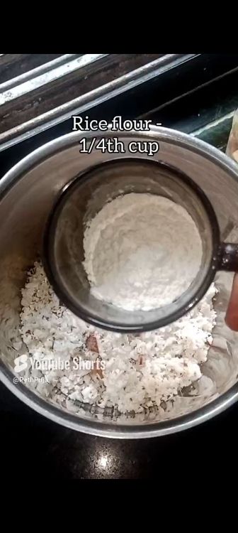 Step 1.4: In a mixie jar, put roasted chana dal, green cardamom pods, grated coconut, rice flour, jaggery powder, water and pinch of salt