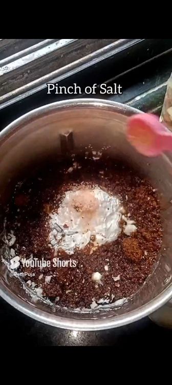 Step 1.6: In a mixie jar, put roasted chana dal, green cardamom pods, grated coconut, rice flour, jaggery powder, water and pinch of salt
