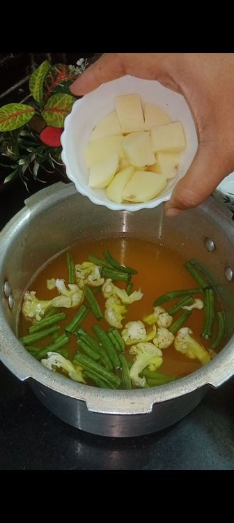 Step 1.3: Add all the veggies one by one as mentioned in the ingredients section from french beans - tomato