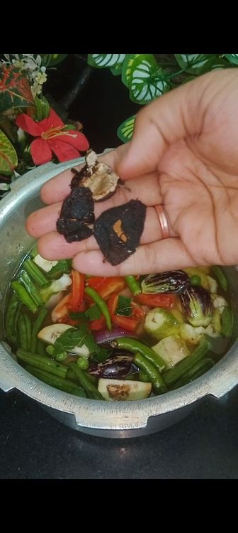 Step 1.2: Next add green chillies & tamarind pieces