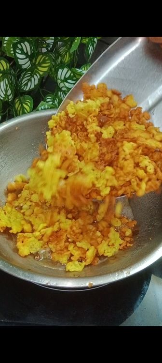 Step 1.1: Drain the boondi on a plate and repeat the process for the remaining batter