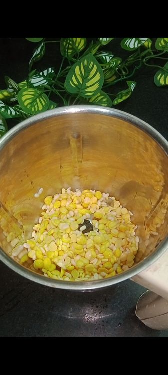 Step 1.1: Drain the soaked dals and transfer them to a grinder