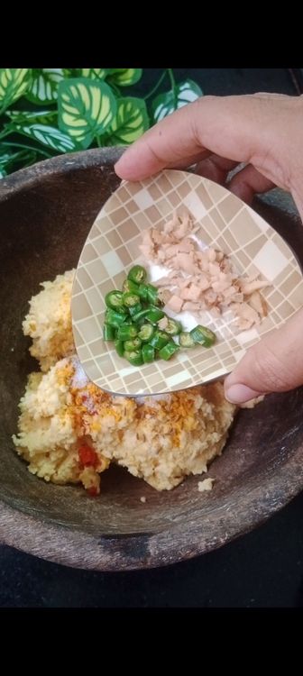 Step 2.2: In a bowl, combine the ground dal mixture with chopped onions, coriander leaves, cumin seeds, turmeric and red chilli powder , salt , ginger and green chillies