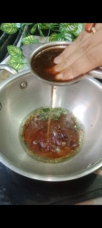 Step 1.1: Then immediately stir in the tamarind pulp