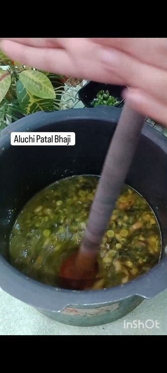Step 1.5: In a pressure cooker , add chana dal , peanuts , water , chopped arbi leaves and it's stem