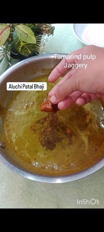 Step 2.2: Pour in soaked tamarind mixture and a piece of jaggery
