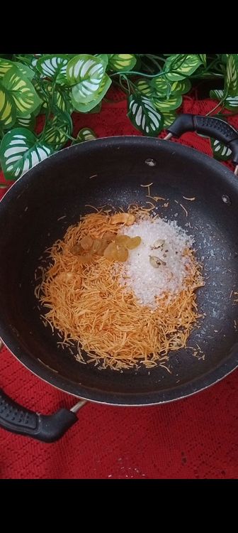 Step 1.1: Once vermicelli is roasted well , add raisins, sugar and crushed cardamom