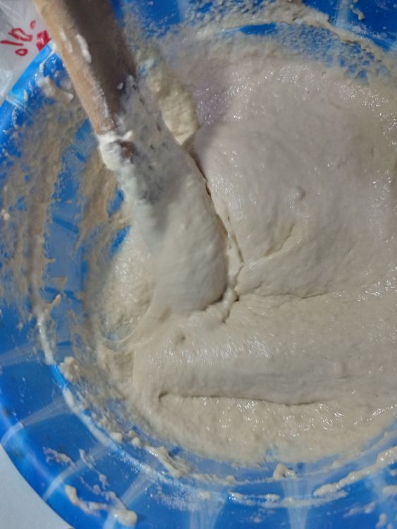 Step 1.2: Add the warm water in bits and mix until you achieve the right consistency (not too thick, not too thin)