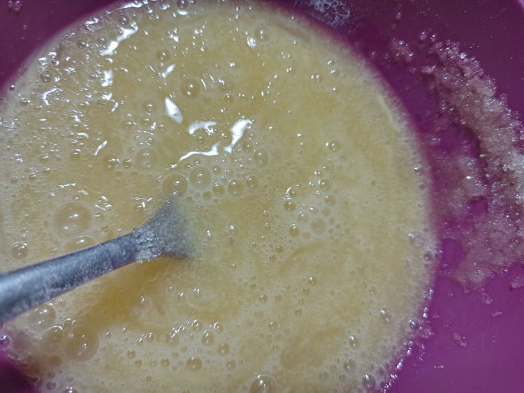 Step 1.1: Add sugar to the egg mixture and mix again