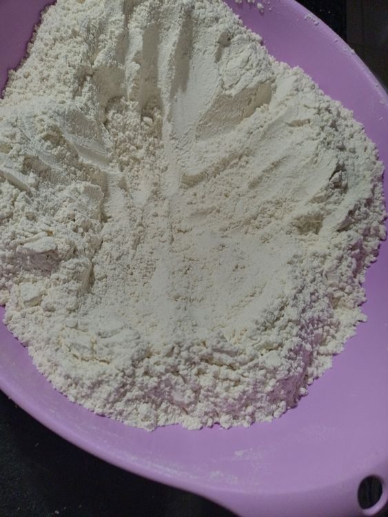 Step 1.1: Make a well in the center of the dry ingredients
