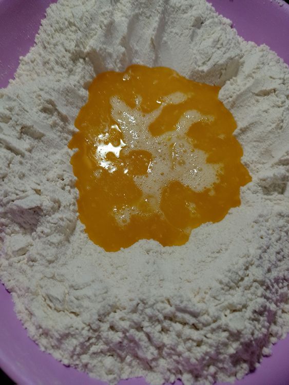 Step 1.2: Pour in the melted butter, egg mixture, and 1 cup of water