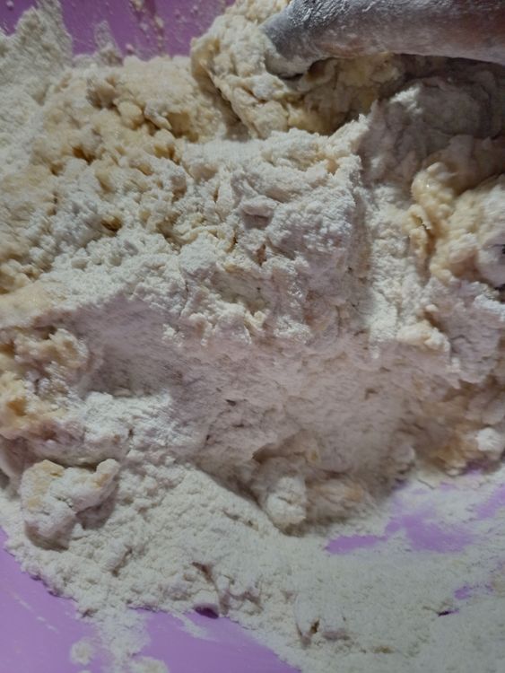Step 1.1: Add the rest of the water and keep mixing until a dough is formed
