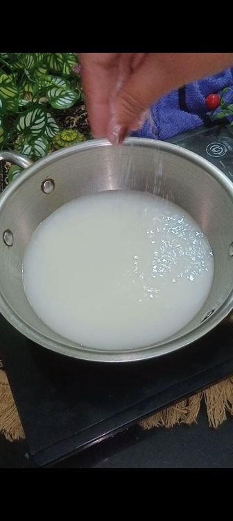 Step 1.2: In a vessel , add 3/4 cup curd with 2 cups of water
