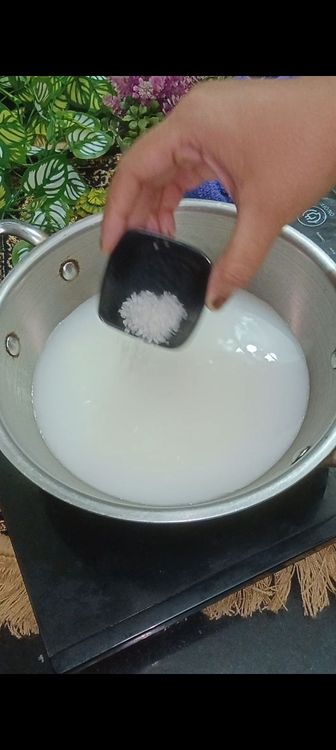 Step 1.3: In a vessel , add 3/4 cup curd with 2 cups of water